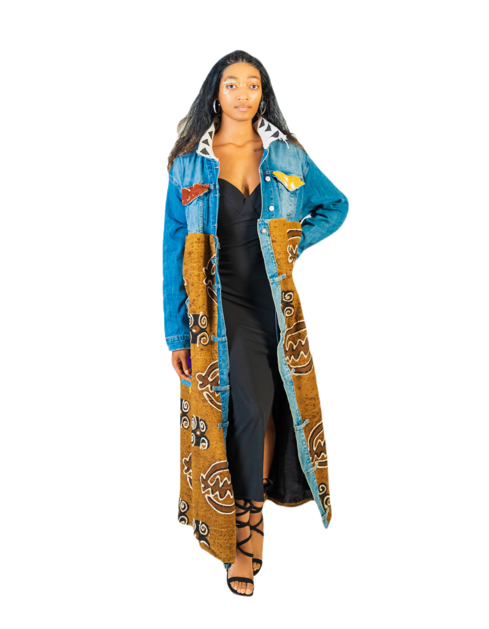 A woman in a long blue and brown coat