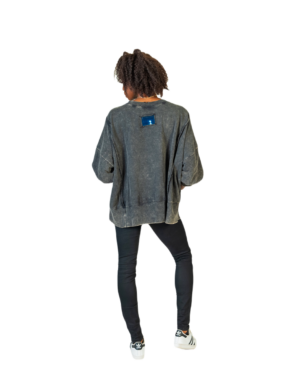 A woman in a grey sweater